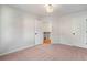 Cozy carpeted bedroom with neutral walls, white trim, and a doorway leading to the hallway at 139 Thunder Ridge Ln, Acworth, GA 30101