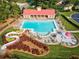 Aerial view showcasing the community pool, water slide, lounge chairs and beautiful landscaping at 139 Thunder Ridge Ln, Acworth, GA 30101