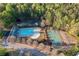 Aerial view showcasing the community pool, basketball court, parking, and surrounding landscaping of the neighborhood at 139 Thunder Ridge Ln, Acworth, GA 30101
