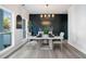 Contemporary dining room with black accent wall and luxury vinyl plank flooring at 139 Thunder Ridge Ln, Acworth, GA 30101