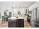 Bright kitchen featuring white cabinets, marble countertops, stainless steel appliances, and a dining area at 139 Thunder Ridge Ln, Acworth, GA 30101