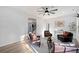 Bright living room featuring modern decor, hardwood floors, and a stylish ceiling fan at 139 Thunder Ridge Ln, Acworth, GA 30101