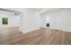 Bright living area showcasing wood floors and a glimpse into the bathroom and adjacent rooms at 139 Thunder Ridge Ln, Acworth, GA 30101