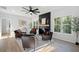 Stylish living room featuring a modern fireplace, hardwood floors, and abundant natural light at 139 Thunder Ridge Ln, Acworth, GA 30101