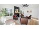 Bright living room featuring a modern fireplace, hardwood floors, and four accent chairs at 139 Thunder Ridge Ln, Acworth, GA 30101