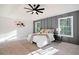 Bright main bedroom featuring a tray ceiling, paneled accent wall, and plush carpet at 139 Thunder Ridge Ln, Acworth, GA 30101