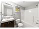 Clean bathroom with a tub, shower, toilet, and vanity with a mirror, providing functionality at 1415 Hialeah Ct, Marietta, GA 30062
