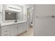 Well-lit bathroom featuring a marble counter and white vanity at 1415 Hialeah Ct, Marietta, GA 30062