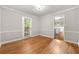 Dining area with hardwood floors, neutral paint, and natural light, adjacent to the kitchen at 1415 Hialeah Ct, Marietta, GA 30062