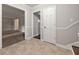 Inviting entryway with neutral tones and tile floors, leading to a spacious carpeted living area at 1415 Hialeah Ct, Marietta, GA 30062