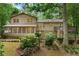 Exterior of the house featuring a back deck, stone foundation and lush landscaping at 1415 Hialeah Ct, Marietta, GA 30062