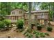 Back of house with back deck and stone foundation with green foliage at 1415 Hialeah Ct, Marietta, GA 30062
