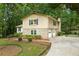 Charming two-story home with stone accents, double garage, and mature trees at 1415 Hialeah Ct, Marietta, GA 30062