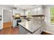 Kitchen with gray cabinets, modern countertops, and stainless steel appliances next to the dining room at 1415 Hialeah Ct, Marietta, GA 30062