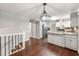 Open-concept kitchen with stainless steel appliances, island, and breakfast area, connecting to the living space at 1415 Hialeah Ct, Marietta, GA 30062