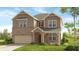 Charming two-story home featuring a brick and vertical siding exterior, with a manicured lawn and inviting entrance at 4014 Dantry Ln, Buford, GA 30519