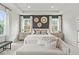 This primary bedroom features an accent wall, with lots of natural light and modern decor at 4014 Dantry Ln, Buford, GA 30519