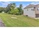 Large landscaped backyard featuring a young tree at 3139 Hilltop Drive, Marietta, GA 30066