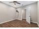 Bedroom with hardwood floors, ceiling fan, and television mount at 3139 Hilltop Drive, Marietta, GA 30066