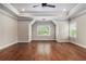 Spacious bedroom features tray ceilings, hardwood floors, and large window at 3139 Hilltop Drive, Marietta, GA 30066