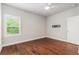 Bedroom featuring hardwood floors, ceiling fan, and large window at 3139 Hilltop Drive, Marietta, GA 30066