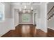 Open dining room featuring beautiful hardwood floors, elegant lighting, and decorative wall trim at 3139 Hilltop Drive, Marietta, GA 30066