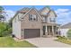 Charming two-story home with brick and siding, featuring a well-maintained lawn and landscaping at 3139 Hilltop Drive, Marietta, GA 30066