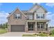 Beautiful two-story brick home with a covered porch, two-car garage and manicured landscaping at 3139 Hilltop Drive, Marietta, GA 30066
