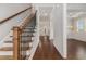 Inviting foyer with hardwood floors, staircase with iron spindles and views of the living spaces at 3139 Hilltop Drive, Marietta, GA 30066