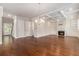 Bright living room with hardwood floors, fireplace, built-ins, and coffered ceilings at 3139 Hilltop Drive, Marietta, GA 30066