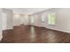 Open concept living room with hardwood floors and large windows at 3139 Hilltop Drive, Marietta, GA 30066