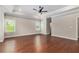Spacious main bedroom with tray ceilings, ceiling fan, plantation shutters, and beautiful hardwood floors at 3139 Hilltop Drive, Marietta, GA 30066