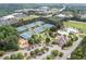Overhead view of community amenities, including tennis courts, swimming pool, and a well-manicured landscape at 6219 Creekstone Path, Cumming, GA 30041