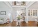 Inviting foyer with hardwood floors, staircase and elegant decor at 6219 Creekstone Path, Cumming, GA 30041