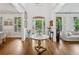 Grand foyer with hardwood floors, arched doorway and bright natural light at 6219 Creekstone Path, Cumming, GA 30041