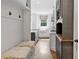 Hallway to Kitchen with custom bench seating and granite countertop at 6219 Creekstone Path, Cumming, GA 30041