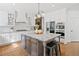 Spacious kitchen with large center island, stainless appliances, granite countertops, and ample storage space at 6219 Creekstone Path, Cumming, GA 30041