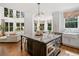 Bright, spacious kitchen featuring a large center island, stainless steel appliances, and an open floorplan at 6219 Creekstone Path, Cumming, GA 30041