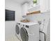 Well-equipped laundry room with modern washer and dryer, storage cabinets, and functional layout at 6219 Creekstone Path, Cumming, GA 30041