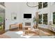 Elegant living room boasts high ceilings, fireplace, large windows, and comfortable seating area at 6219 Creekstone Path, Cumming, GA 30041
