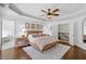 Bedroom features include ceiling fan, hardwood floors, and an ensuite bathroom at 6219 Creekstone Path, Cumming, GA 30041