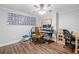 Well-lit home office features a creative workspace and laminate wood flooring, perfect for productivity at 6219 Creekstone Path, Cumming, GA 30041
