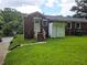 View of the backyard with a small storage shed and stairs to the back door of the house at 1753 Cahoon Sw St, Atlanta, GA 30310