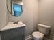 Small bathroom with updated vanity, sink, and tile flooring at 1753 Cahoon Sw St, Atlanta, GA 30310