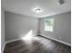 Bright bedroom featuring laminate flooring and a window for natural light at 1753 Cahoon Sw St, Atlanta, GA 30310