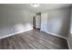 Well lit bedroom featuring wood-look laminate flooring at 1753 Cahoon Sw St, Atlanta, GA 30310