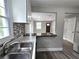 Bright kitchen featuring a breakfast bar and a seamless flow into the living area at 1753 Cahoon Sw St, Atlanta, GA 30310