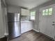 Modern kitchen with stainless steel refrigerator and ample cabinet space at 1753 Cahoon Sw St, Atlanta, GA 30310