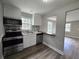 Well-lit kitchen featuring modern appliances and a view into the living space at 1753 Cahoon Sw St, Atlanta, GA 30310