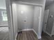 The laundry room features wood-look flooring, a window, and grey walls at 1753 Cahoon Sw St, Atlanta, GA 30310